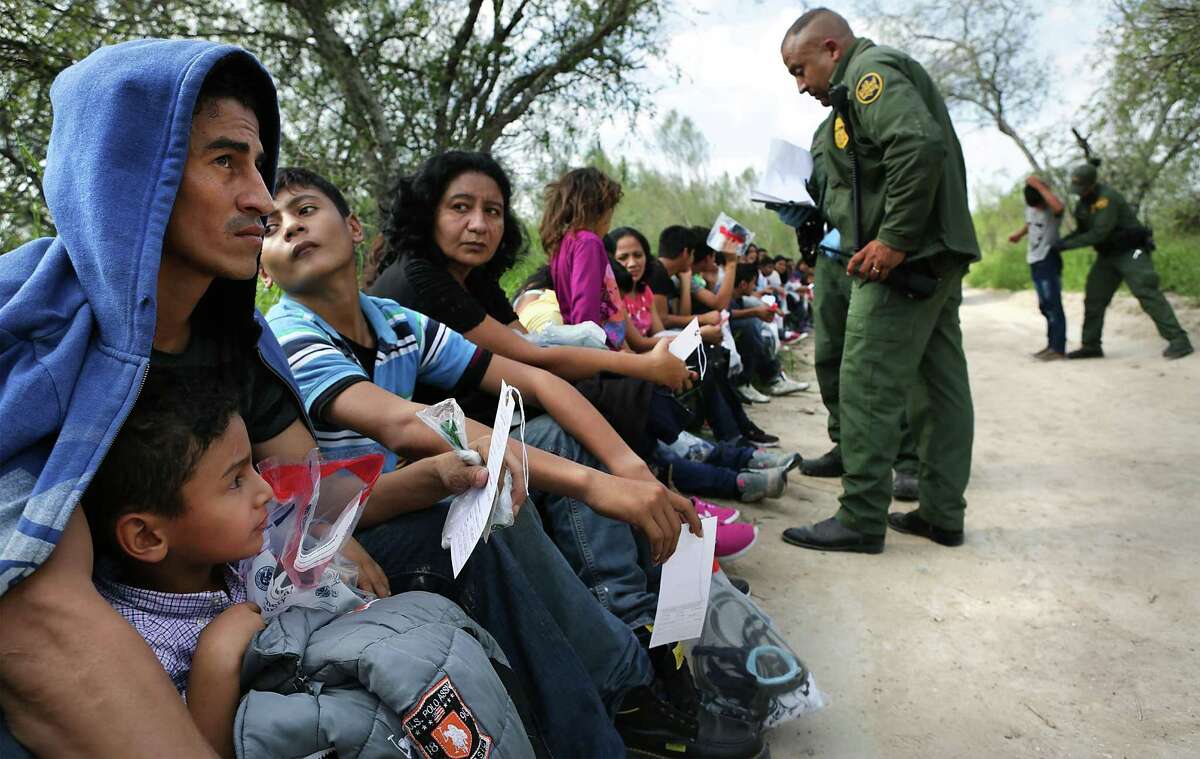 Border Patrol officers question immigrants that had just crossed the Rio Grande River near Rincon Village south of Granjeno, TX, on Wednesday, Nov. 23, 2016.
