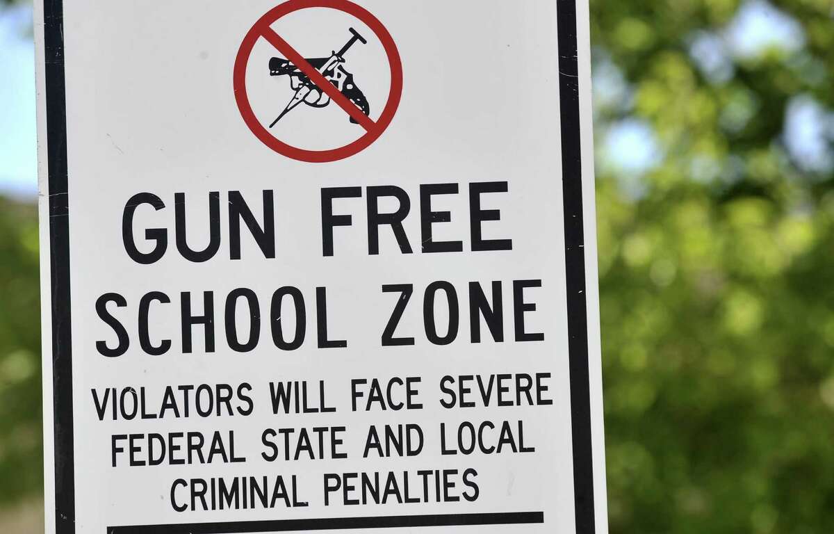 A gun free zone sign is posted at Palo Duro High School Monday, Sept. 10, 2012.