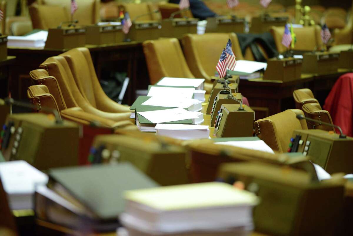 Bills sit on the desks of lawmakers in the Assembly Chamber on Monday afternoon, March 30, 2015, at the Capitol in Albany, N.Y. The Legislature has yet to hand up 25 bills passed during the 2016 legislative session, though there isn?t any imminent requirement that they do so. (Will Waldron/Times Union archive)