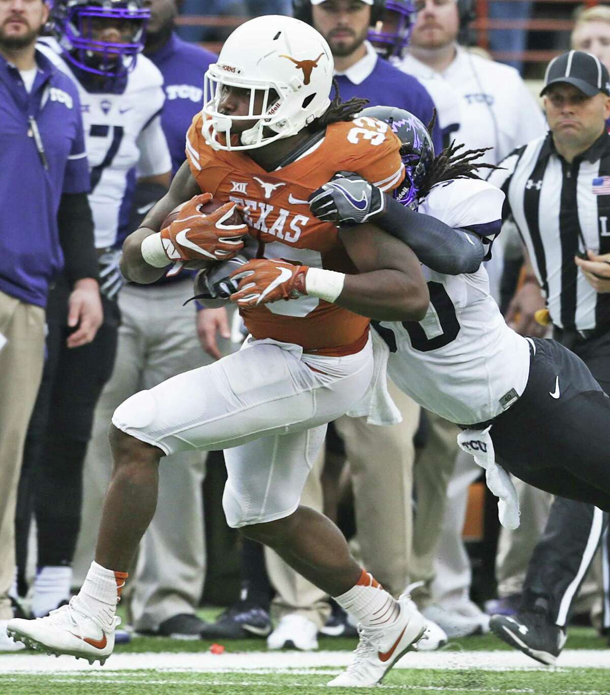 UT running back D’Onta Foreman churns out yards on a long gain in the first half against TCU at Royal-Memorial Stadium on Nov. 25, 2016, in Austin.