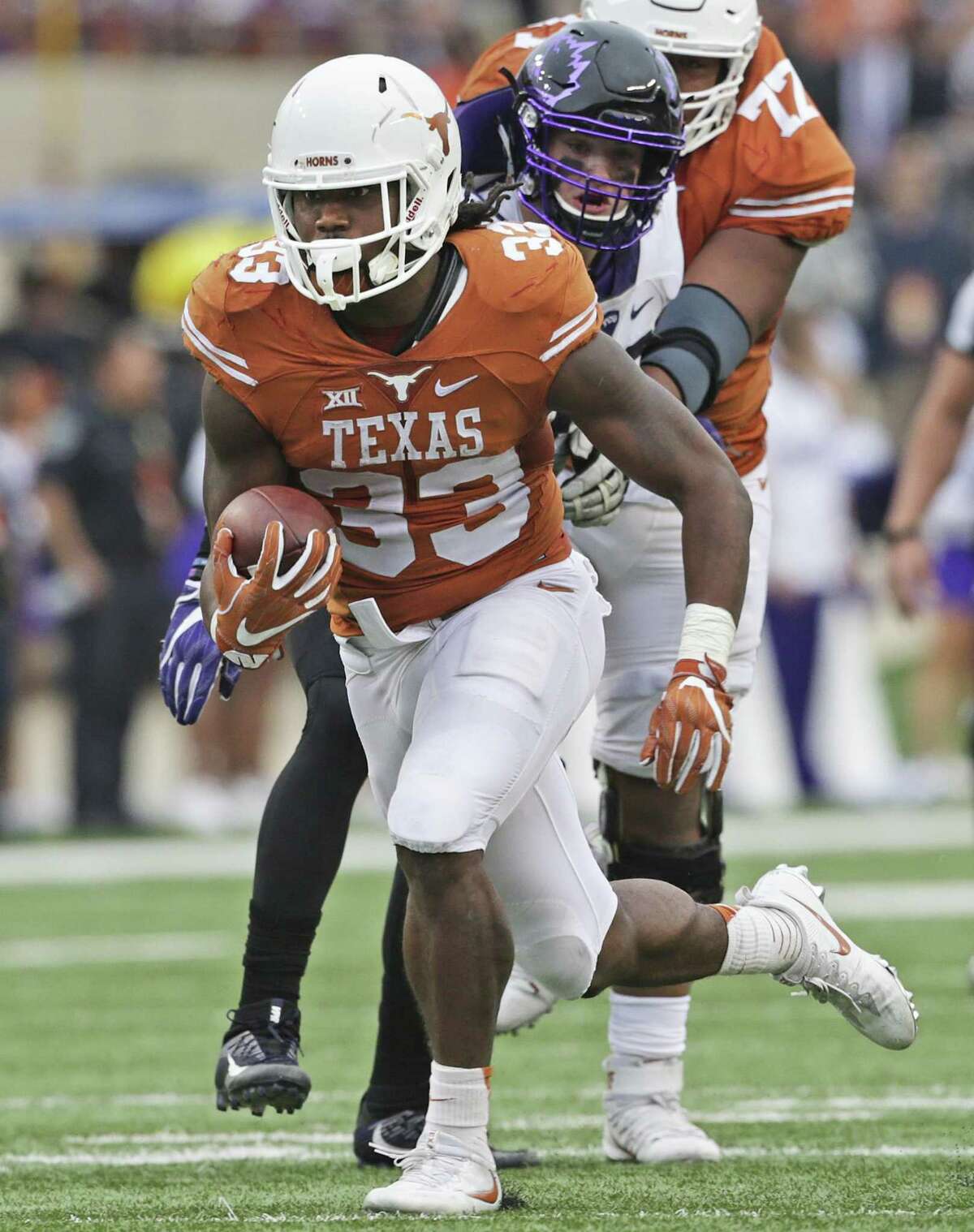 Texas’ D’Onta Foreman breaks through an opening untouched and runs for a long gain against TCU at Royal-Memorial Stadium in Austin on Nov. 25, 2016.