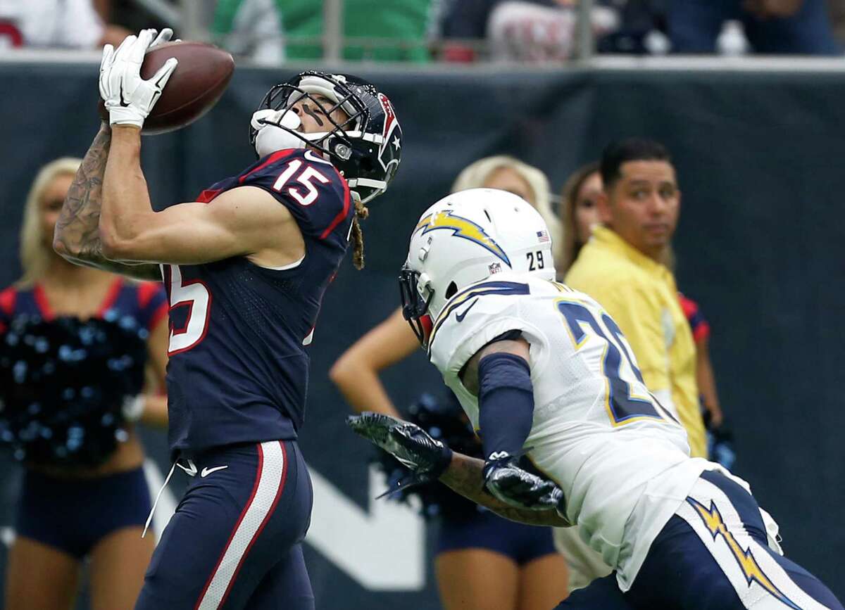 Houston Texans wide receiver Will Fuller (15) makes a 33-yard reception with San Diego Chargers strong safety Craig Mager (29) defending during the second quarter of an NFL football game at NRG Stadium on Sunday, Nov. 27, 2016, in Houston.