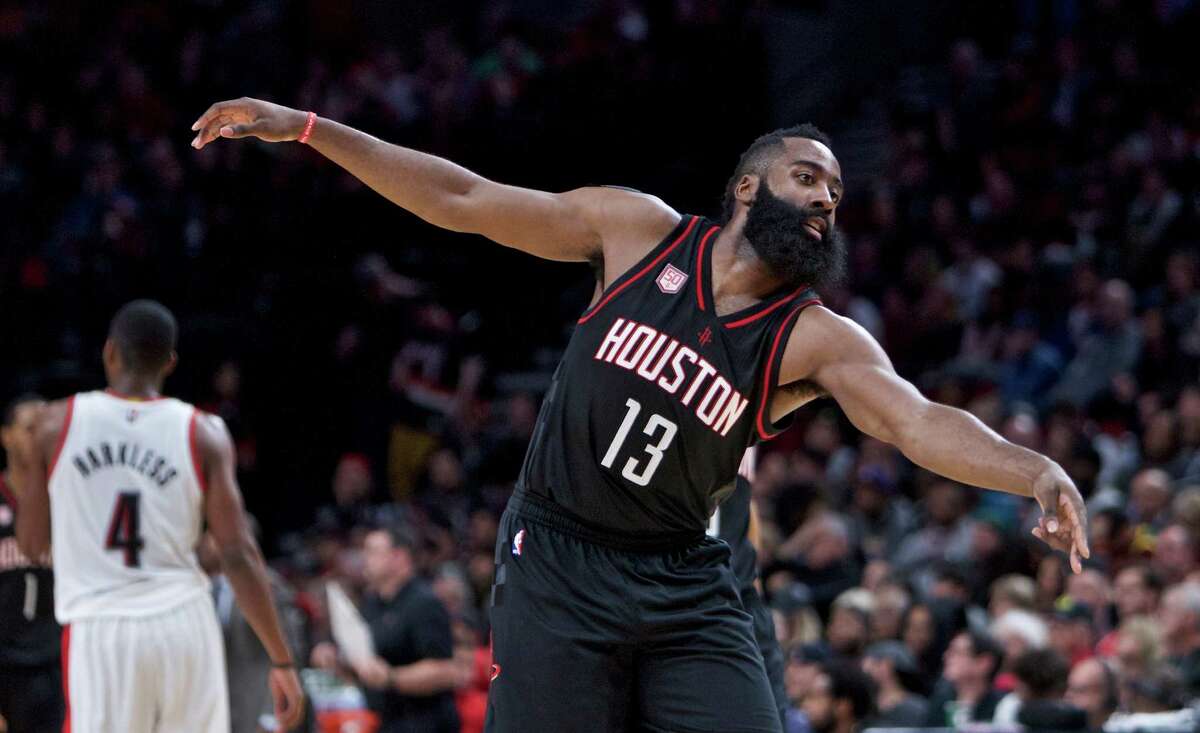 Houston Rockets guard James Harden reacts after making a basket against the Portland Trail Blazers during the second half of an NBA basketball game in Portland, Ore., Sunday, Nov. 27, 2016. The Rockets won 130-114. (AP Photo/Craig Mitchelldyer)