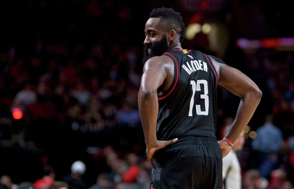 Houston Rockets guard James Harden smiles during the second half of an NBA basketball game against the Portland Trail Blazers in Portland, Ore., Sunday, Nov. 27, 2016. The Rockets won 130-114. (AP Photo/Craig Mitchelldyer)