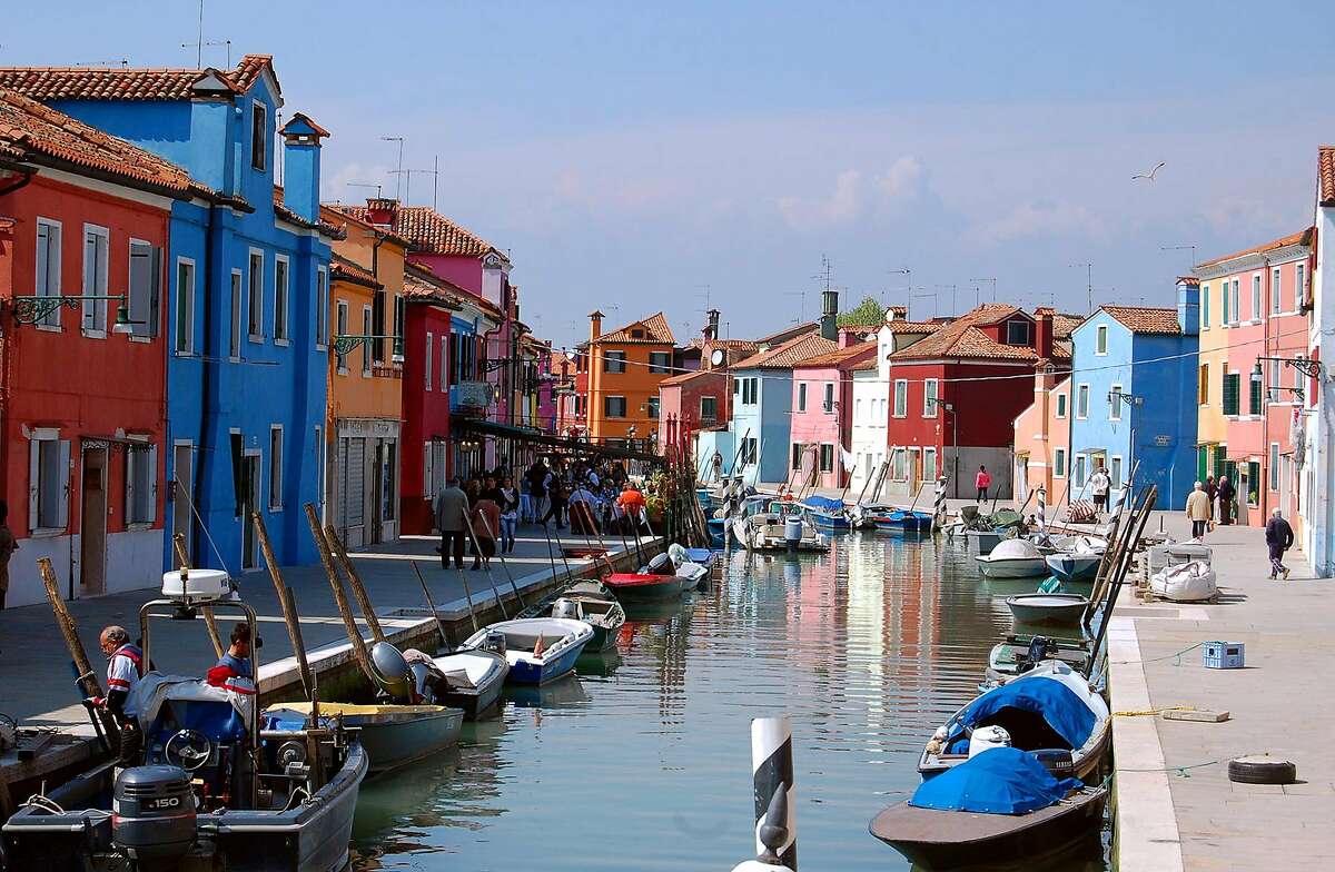 Colorful buildings line the canals of the small island of Burano in Venice�s lagoon.