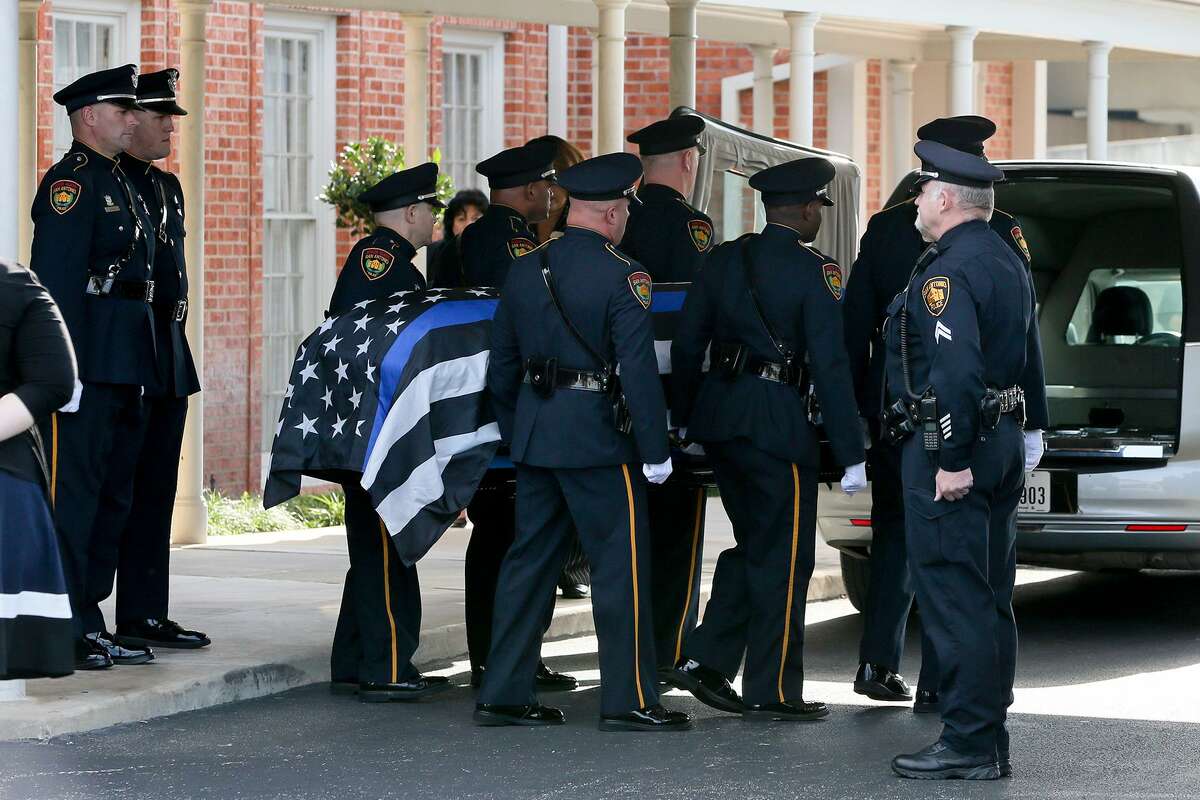 as the casket bearing the body of SAPD Det. Benjamin Marconi leaves Porter Loring Mortuary, 1101 McCullough Ave., for funeral services at the Community Bible Church on Loop 1604 on Monday, Nov. 28, 2016. Marconi was shot dead in his patrol car outside police headquarters on Nov. 20. MARVIN PFEIFFER/ mpfeiffer@express-news.net