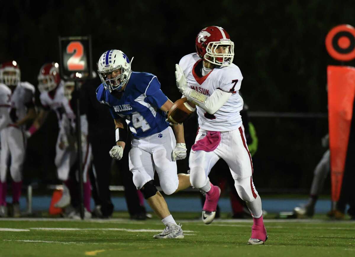 Nicholas Dellapiano (7) of the Masuk Panthers runs for a touchdown during a game against the Bunnell Bulldogs on Oct. 28 at Bunnell High School in Stratford. Dellapiano has rushed for 431 yards and seven touchdowns on the ground. As a receiver, Dellapiano has 561 yards and nine touchdowns.