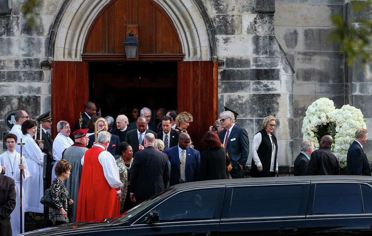 Friends and family of famed heart surgeon Denton Cooley leave Trinity Episcopal Church on Monday after a low-key memorial service celebrating his life and achievements. He died at home on Nov. 18, four weeks after the death of his wife of 67 years.