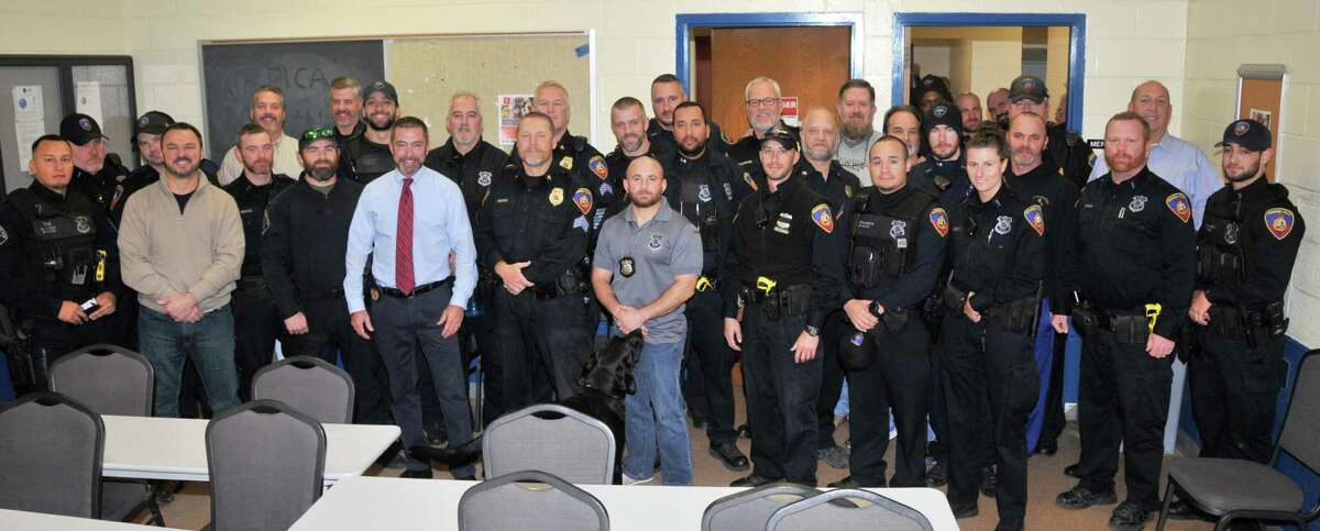 Stamford police officers, mainly from the patrol division's Squad B, show off their beards after participating this month in the No Shave November cancer awareness and prevention fundraiser.