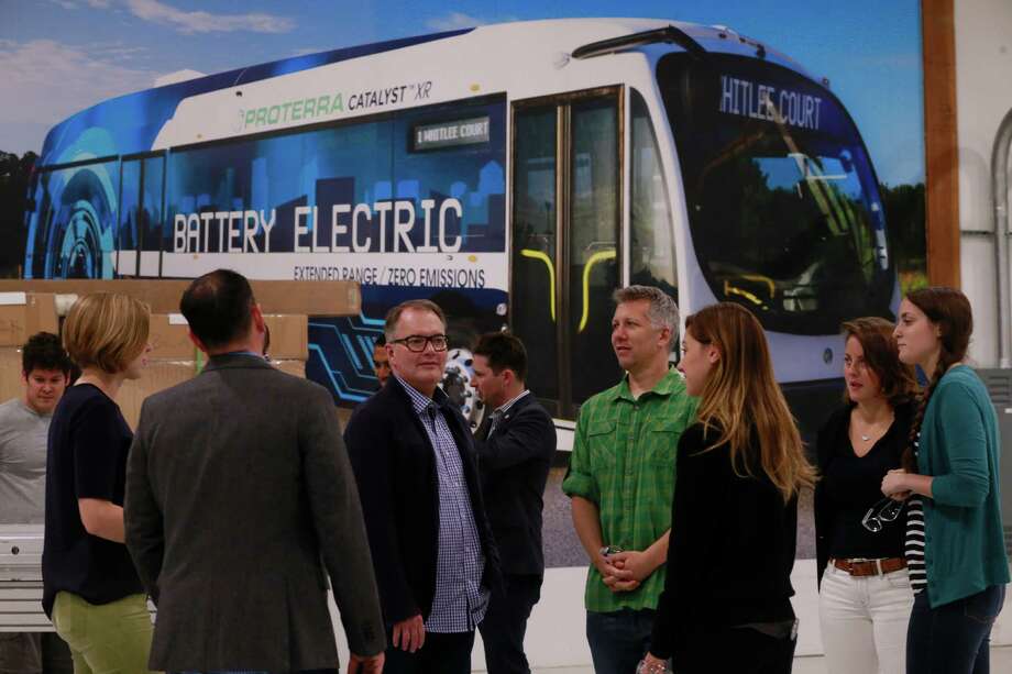 Metro To Test Electric Bus Next Month Houston Chronicle Members Of Engineering Team Gather At The Headquarters Proterra An Electric Bus Company