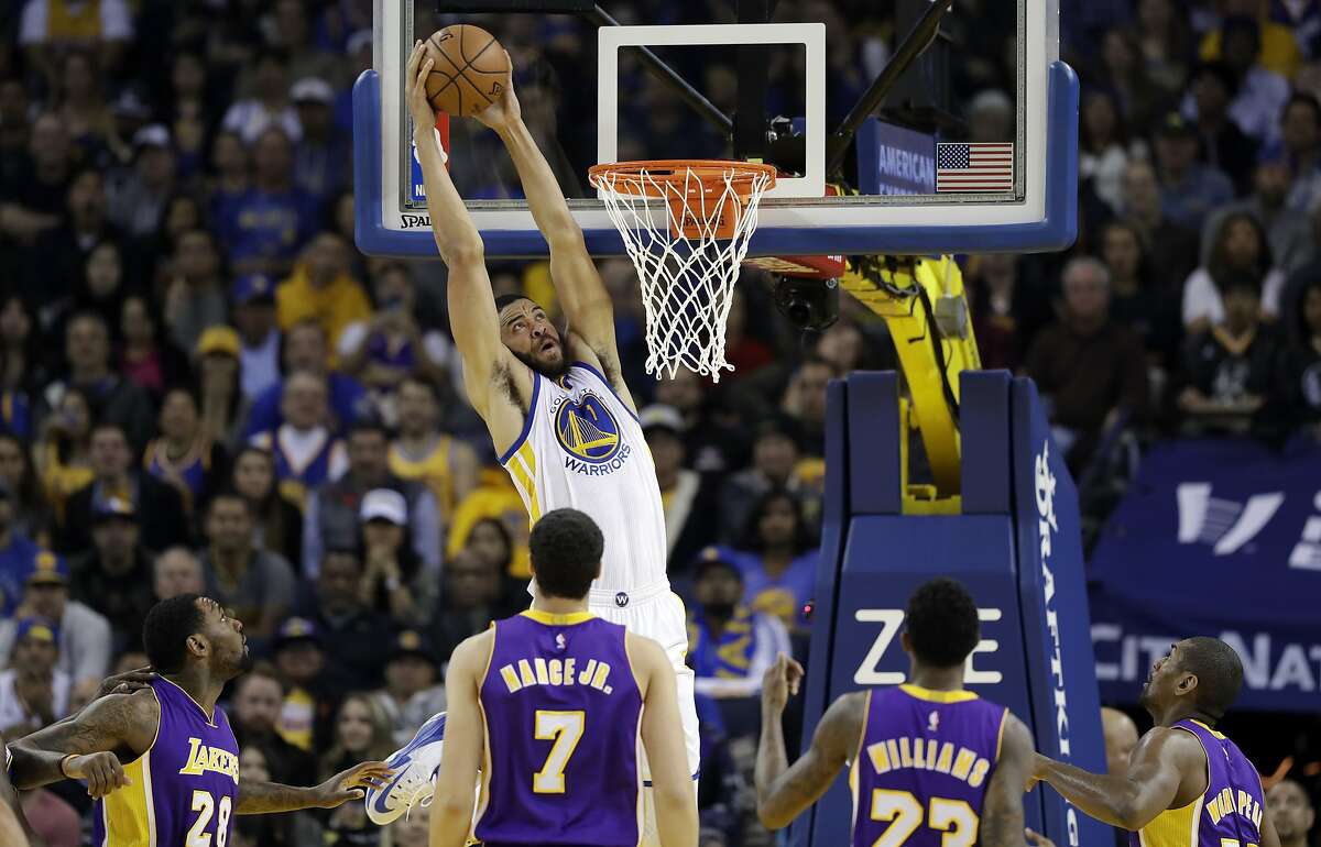 Golden State Warriors' JaVale McGee (1) dunks against the Los Angeles Lakers during the first half of an NBA basketball game Wednesday, Nov. 23, 2016, in Oakland, Calif. (AP Photo/Marcio Jose Sanchez)