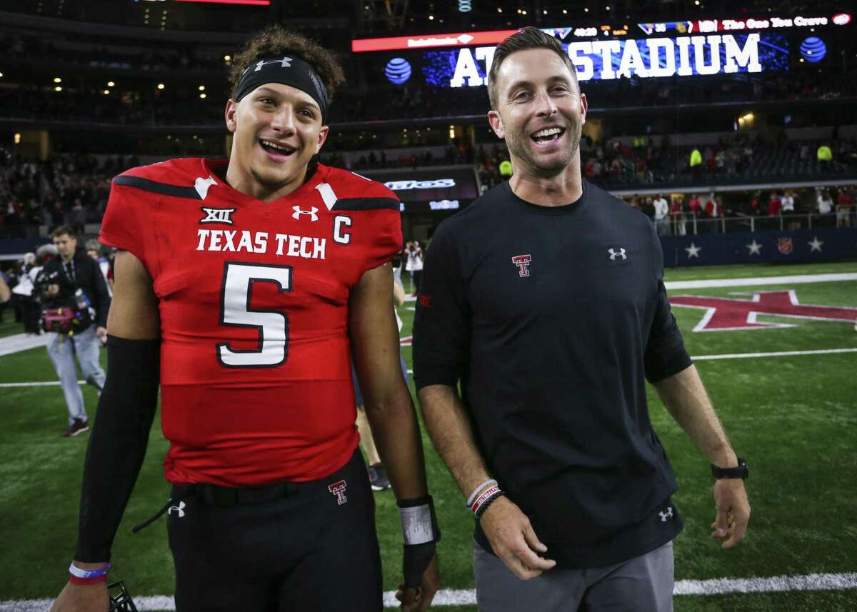 Texas Tech quarterback Patrick Mahomes II and coach Kliff Kingsbury walk off the field after after a 54-35 win over Baylor at AT&T Stadium in Arlington on Nov. 25, 2016.