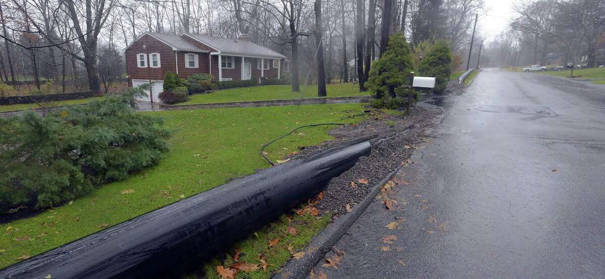 An 18 inch pipe cuts under the driveway of Merlin Alper Davenport Ridge Lane home in Stamford on Nov. 29, 2016. Alper, like many of his neighbors are talking about the big ugly pipe now running across their lawns. Aquarion installed the pipe to bring 4 million gallons of water a day into Stamford from Bridgeport. The Stamford reservoirs are less than half what they should because of the drought.