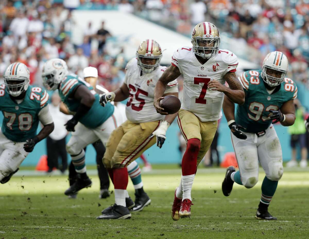 San Francisco 49ers quarterback Colin Kaepernick (7) run the ball, during the second half of an NFL football game against the Miami Dolphins, Sunday, Nov. 27, 2016, in Miami Gardens, Fla. 