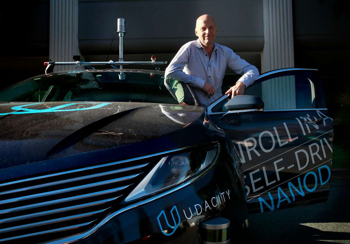 Sebastian Thrun, a pioneer of self-driving technology is the founder of Udacity an online learning company that offers nano degrees to prepare students for technology jobs, is seen with their self driving car in front of their headquarters in Mountain View,, California on Tuesday November 29, 2016.