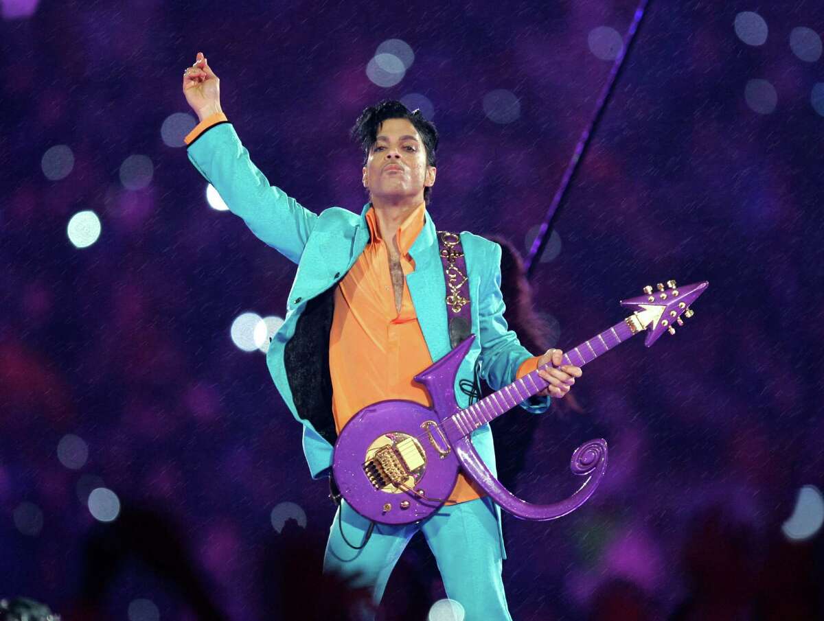 FILE - In this Feb. 4, 2007 file photo, Prince performs during the halftime show at the Super Bowl XLI football game at Dolphin Stadium in Miami. The disclosure that some pills found at Prince's Paisley Park home and studio were counterfeit and contained the powerful synthetic opioid fentanyl strongly suggests they came to the superstar illegally. Prince died April 21, 2016, of an accidental fentanyl overdose. (AP Photo/Chris O'Meara, File)