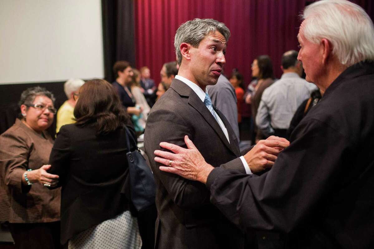 Councilman Ron Nirenberg speaks with an attendee who declined to give his name after the end of Cultural Conversations: Fairness Forward, an event Nirenberg hosted at Santikos Bijou Cinema Bistro in San Antonio, Texas on November 29, 2016. Ray Whitehouse / for the San Antonio Express-News