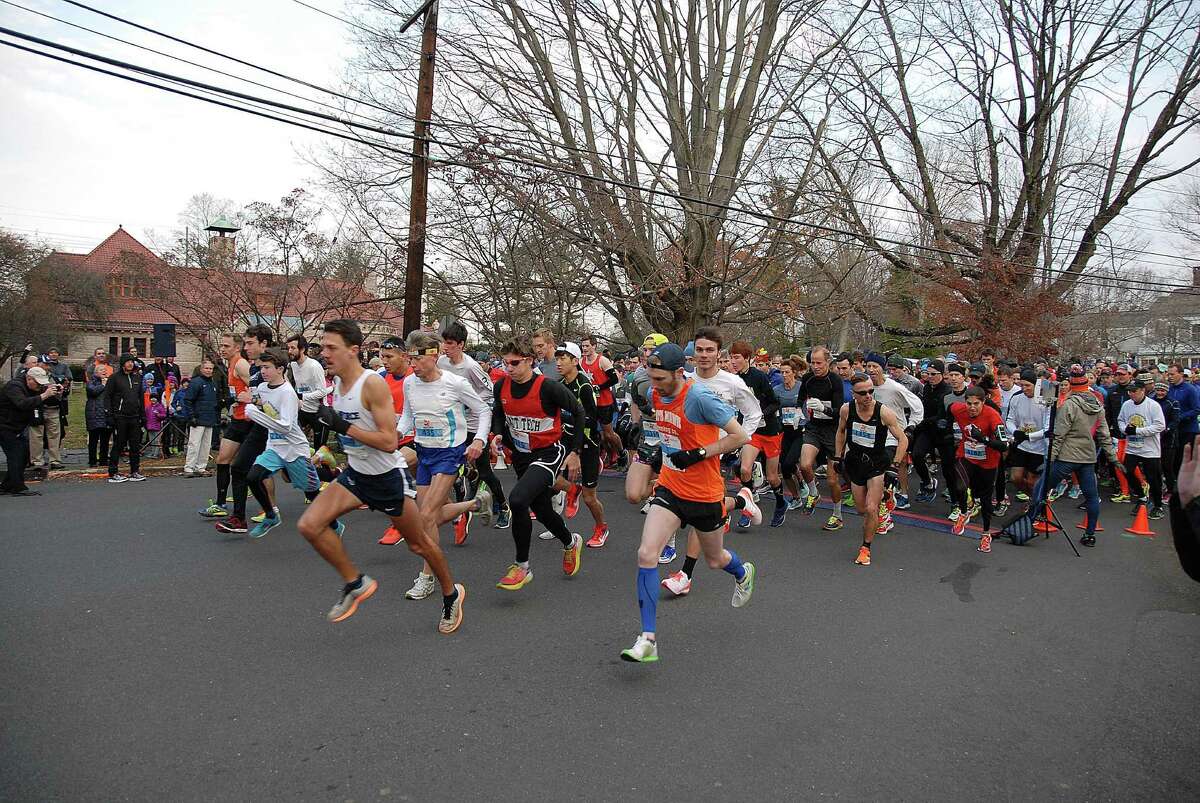 Racers take off at the Pequot Road Race on Thanksgiving in Southport, Conn.