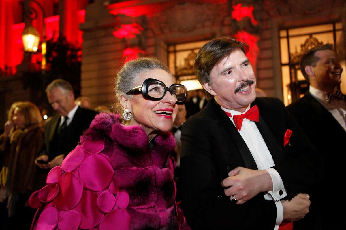 Joy Bianchi and John Rosin wait to cross the street to attend the performance of the San Francisco Ballet season-opening gala on Thursday, Jan. 24, 2013.