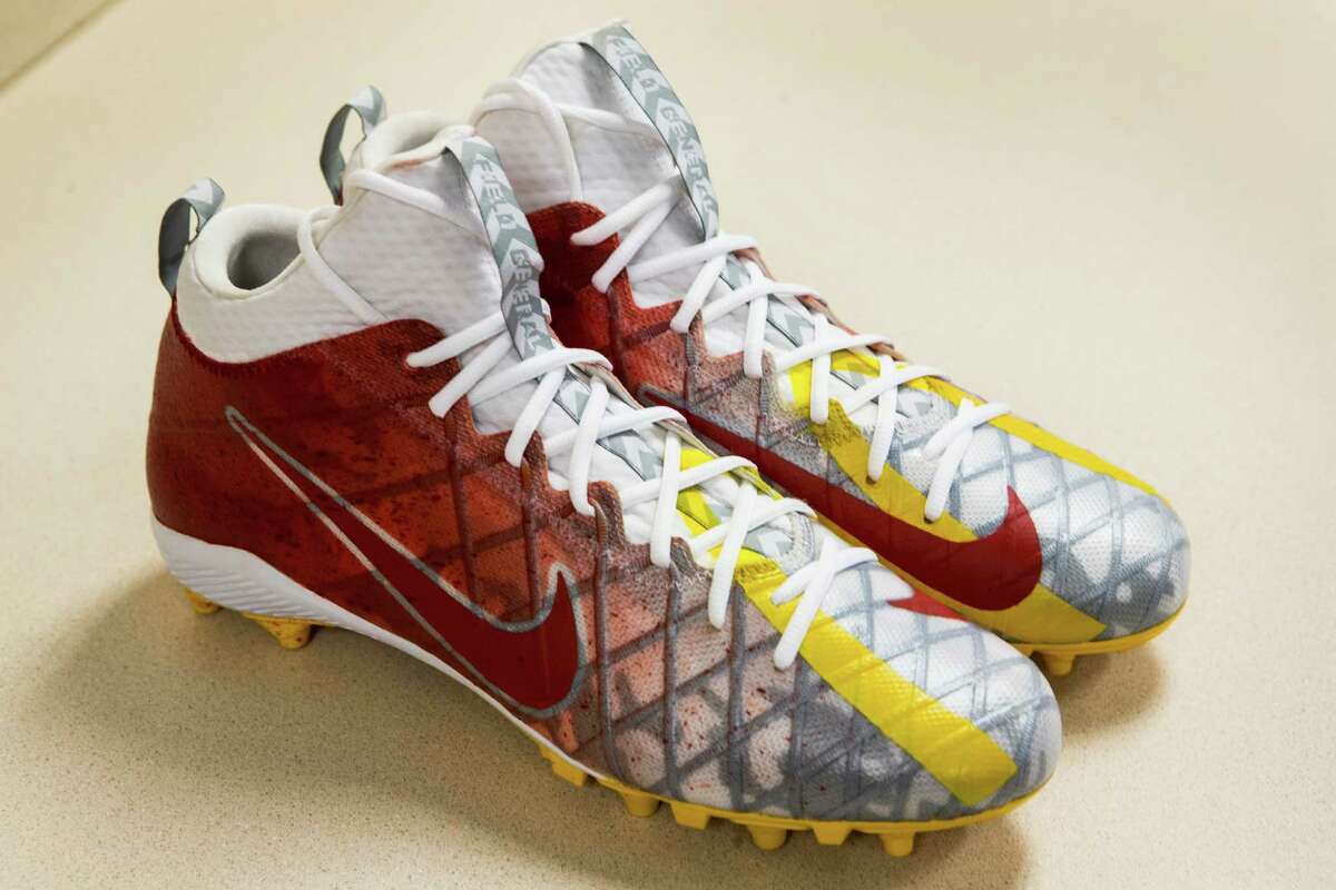 Houston Texans quarterback Brock Osweiler's custom cleats, supporting Ronald McDonald House Houston, are shown at NRG Stadium on Wednesday, Nov. 30, 2016, in Houston. Texans players will wear customized cleats as part of the NFL's My Cause, My Cleats campaign. More than 500 players are planning to showcase their causes by wearing the cleats on the field during the week 13 games.