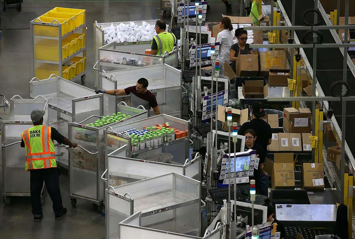 Amazon criticized for vast online reach amid record sales