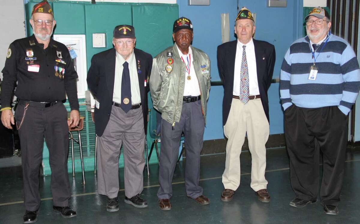 Schaghticoke Middle School in New Milford annually honors veterans of SMS families for students and staff. This year the school hosted five local veterans who volunteered to speak with students at a Veterans Day assembly. After the assembly, veterans visited several classrooms. Above, veterans are, from left to right, James Delancy, Frederick Camp, Herman Izzard, Don Hayes and Robert Coppola.