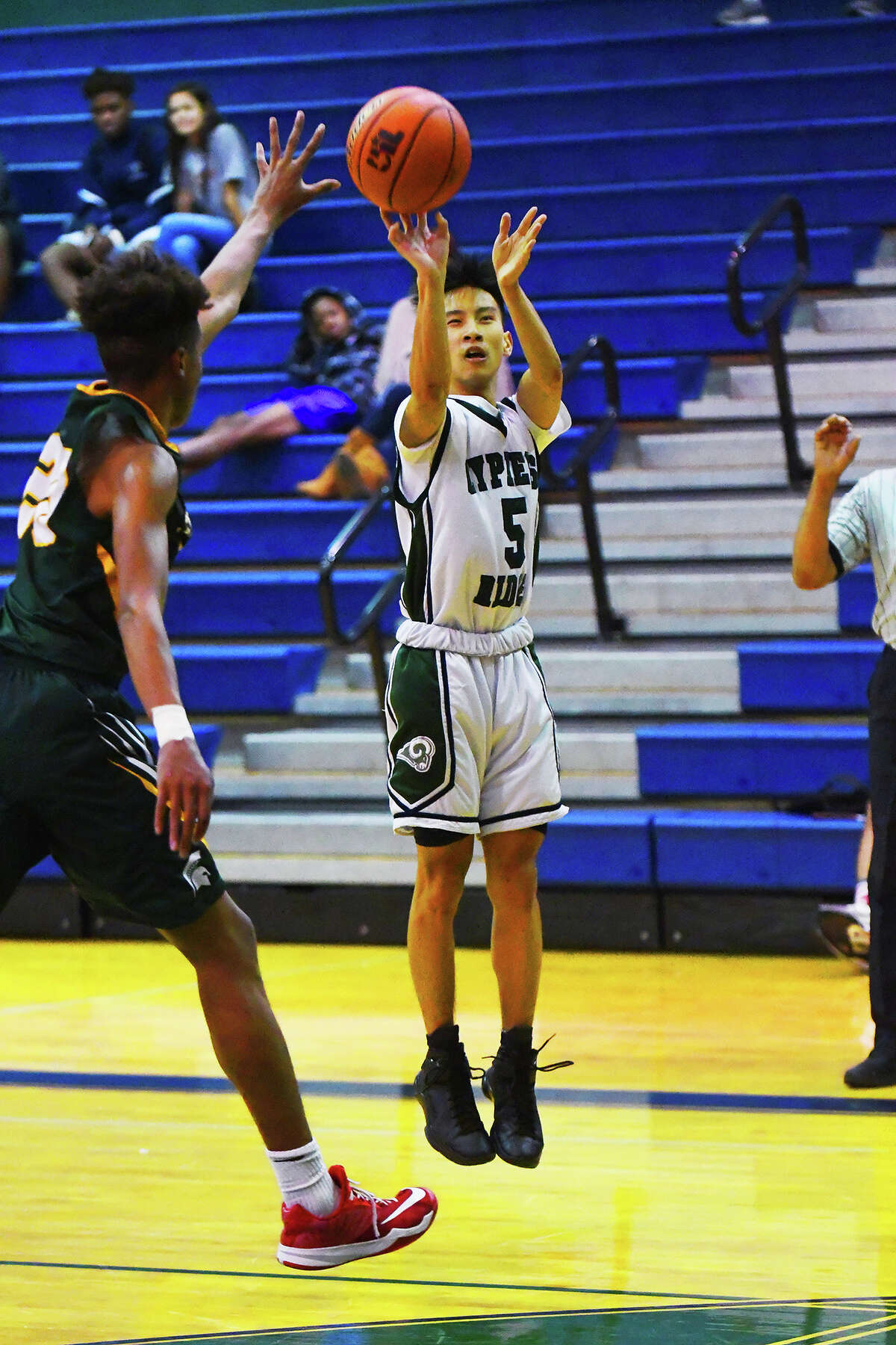 Cy Ridge senior guard Andre Tran puts up a shot from behind the arc Tuesday against Stratford. Though the Rams fell to the Spartans 102-78, Tran enjoyed a productive, effective day at the office, scoring 19 points and orchestrating the Cy Ridge offense.