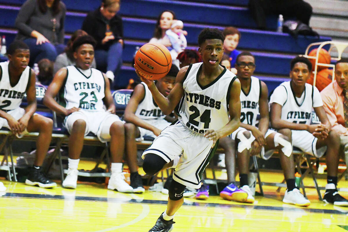 Cy Ridge freshman guard Jestin Porter carries the ball up the court against Stratford at home Tuesday. Porter was the last of the Rams to join the three-point party, sinking a shot from deep in the fourth quarter of the contest, becoming the seventh Ram to do so in the game.
