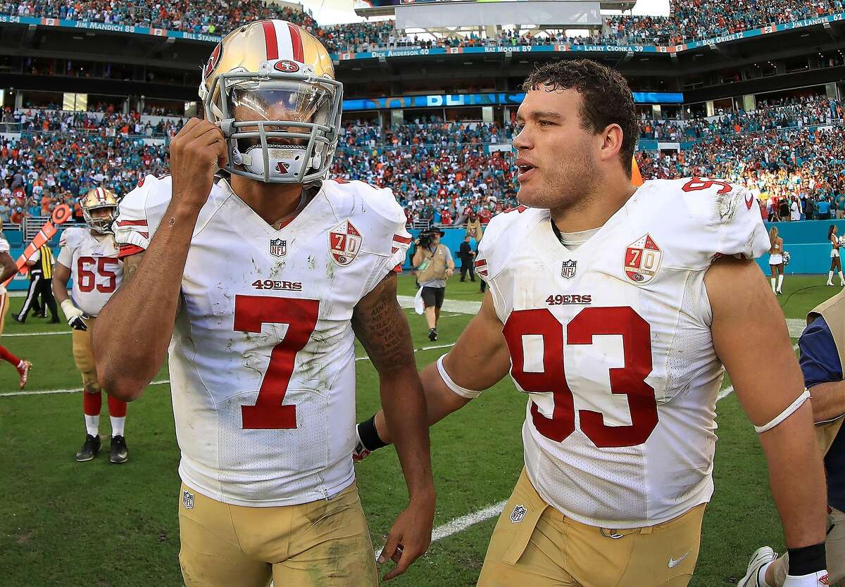 MIAMI GARDENS, FL - NOVEMBER 27: Colin Kaepernick #7 and Chris Jones #93 of the San Francisco 49ers looks on during a game against the Miami Dolphins on November 27, 2016 in Miami Gardens, Florida. (Photo by Mike Ehrmann/Getty Images)