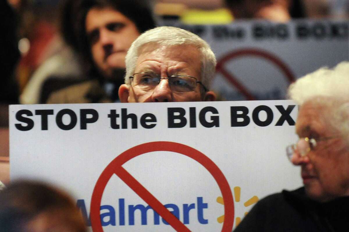 Resident Robert DeMayo shows his opposition during a public hearing on a proposed 137,000 square-foot Walmart on Thursday, Nov. 20, 2014, at Ballston Spa High in Ballston Spa, N.Y. (Cindy Schultz / Times Union archive)