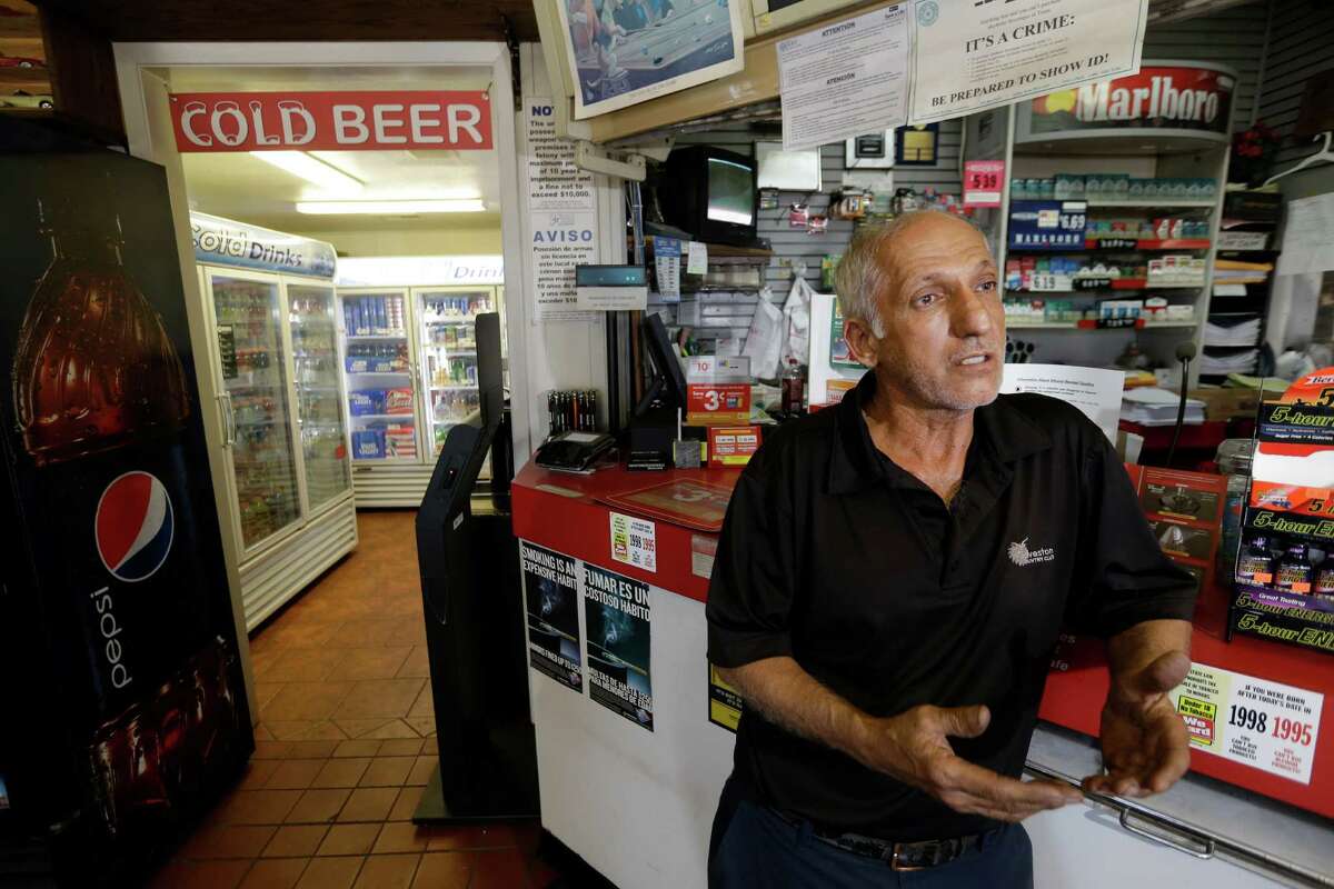 Mehran "Ron" Jadidi, owner of the Shell store, talks Wednesday about telling his employee by phone to call the police after a man stole a beer on Tuesday.