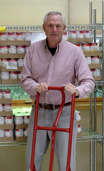 Bruce Sowalski unloads food at the St. Vincent's Parish Food Pantry Monday Sept. 26 2016 in Albany, N.Y. Sowalski died of COVID-19 in 2020. (Skip Dickstein/Times Union)