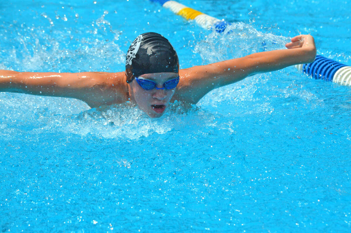 Canon Adams of Water Works competes in the 13-14 boys 100-yard IM.