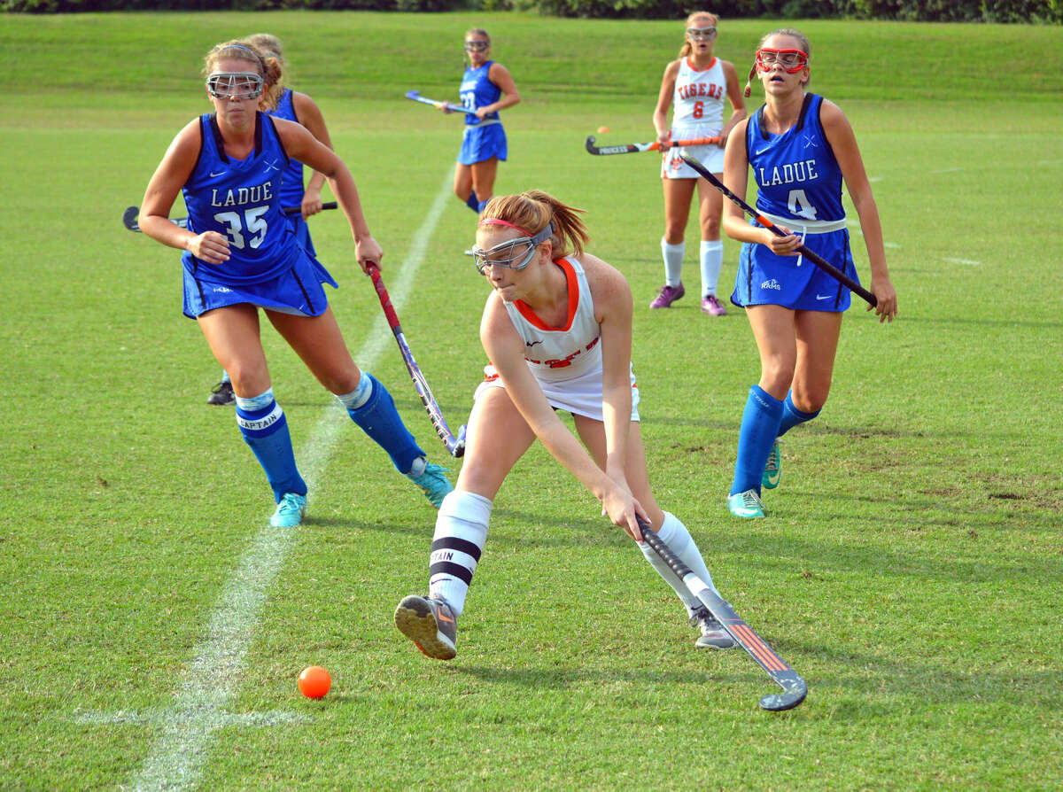 EHS senior Veronica Carrow, center, tries to keep the ball away from a pair of Ladue players.