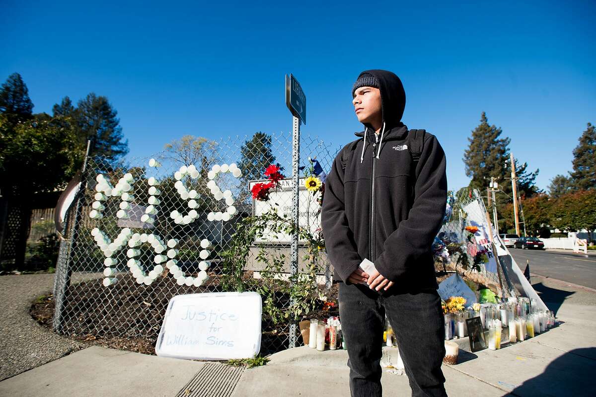 Mataio Tupuola-Mair poses for a portrait at a memorial for murder victim William Sims on Thursday, Dec. 1, 2016, in El Sobrante, Calif. Investigators said Sims, a 28-year-old African American musician, was targeted because of his race.