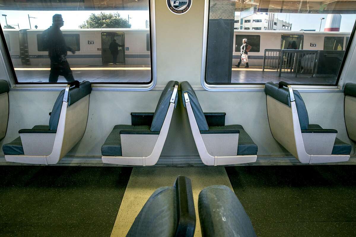 People walk inside the Richmond BART Station on on Thursday, Dec. 1, 2016 in Richmond, Calif. On this 4-car train, one of the cars has been modified with a row of single-passenger seats.
