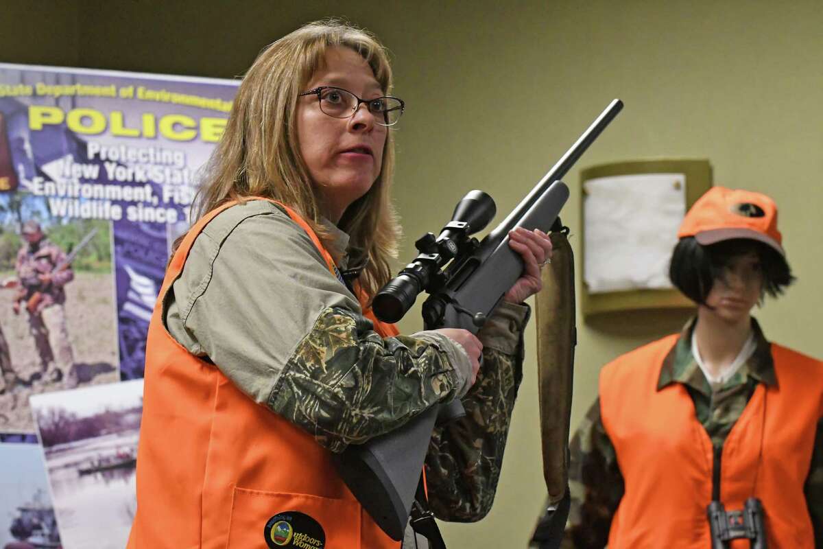 NY DEC Sportsman Education instructor Colleen Kimble gives a gun safety demonstration on Thursday, Dec. 1, 2016, in Albany, N.Y. (Michael P. Farrell/Times Union)