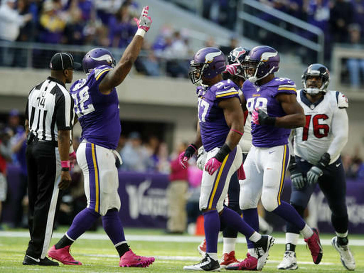 Minnesota Vikings defenders Tom Johnson, from left, Everson Griffen and Danielle Hunter celebrate after sacking Houston Texans quarterback Brock Osweiler during the second half of an NFL football game Sunday, Oct. 9, 2016, in Minneapolis. The Vikings won 31-13. (AP Photo/Jim Mone)