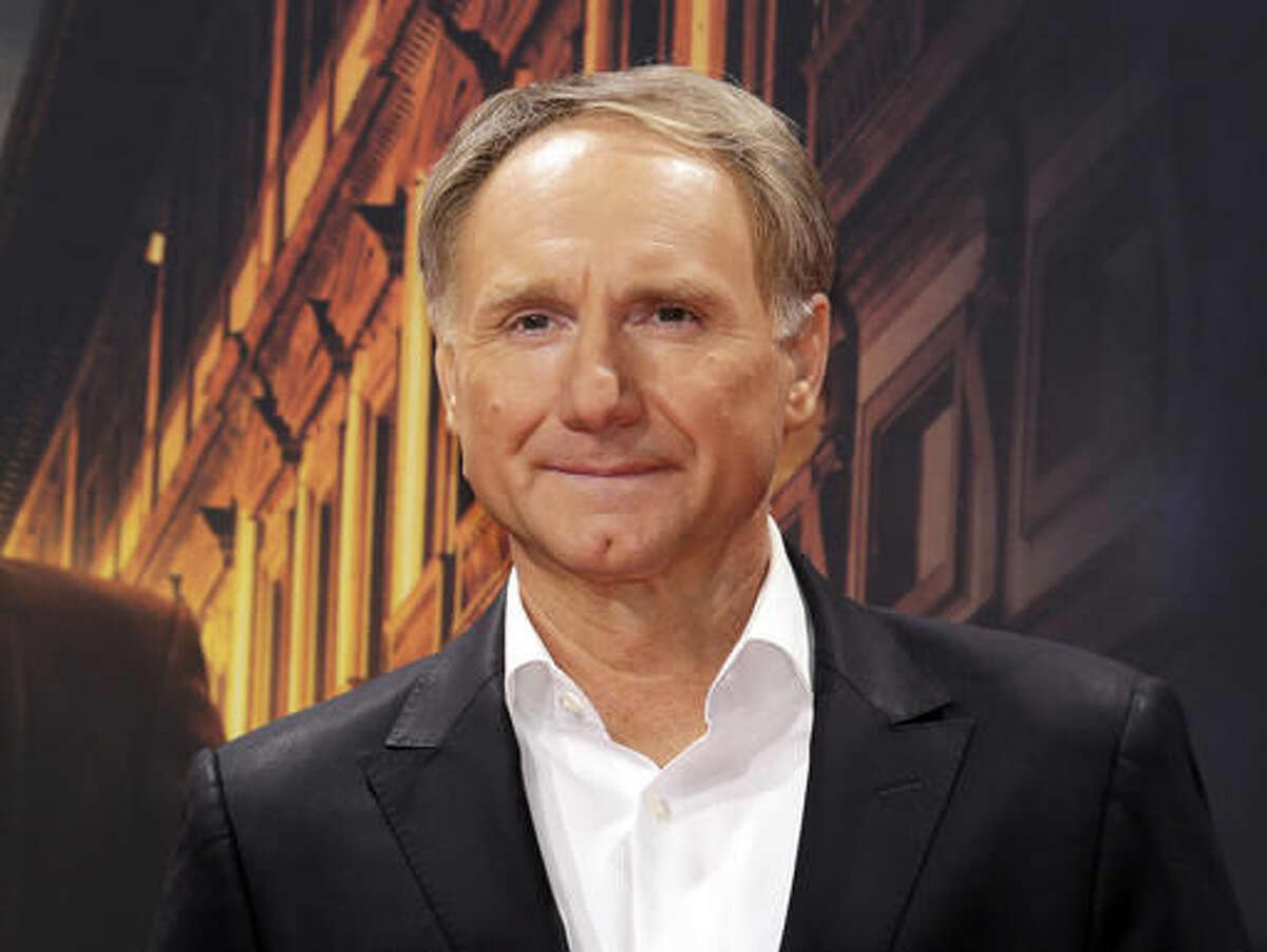 FILE - In this Oct. 10, 2016 file photo, author Dan Brown arrives for the premiere of the movie "Inferno" in Berlin. Brown will attend BookCon, the fourth annual fan-based show to be held next June 3-4 at the Jacob K. Javits Convention Center in New York. (AP Photo/Markus Schreiber, File)