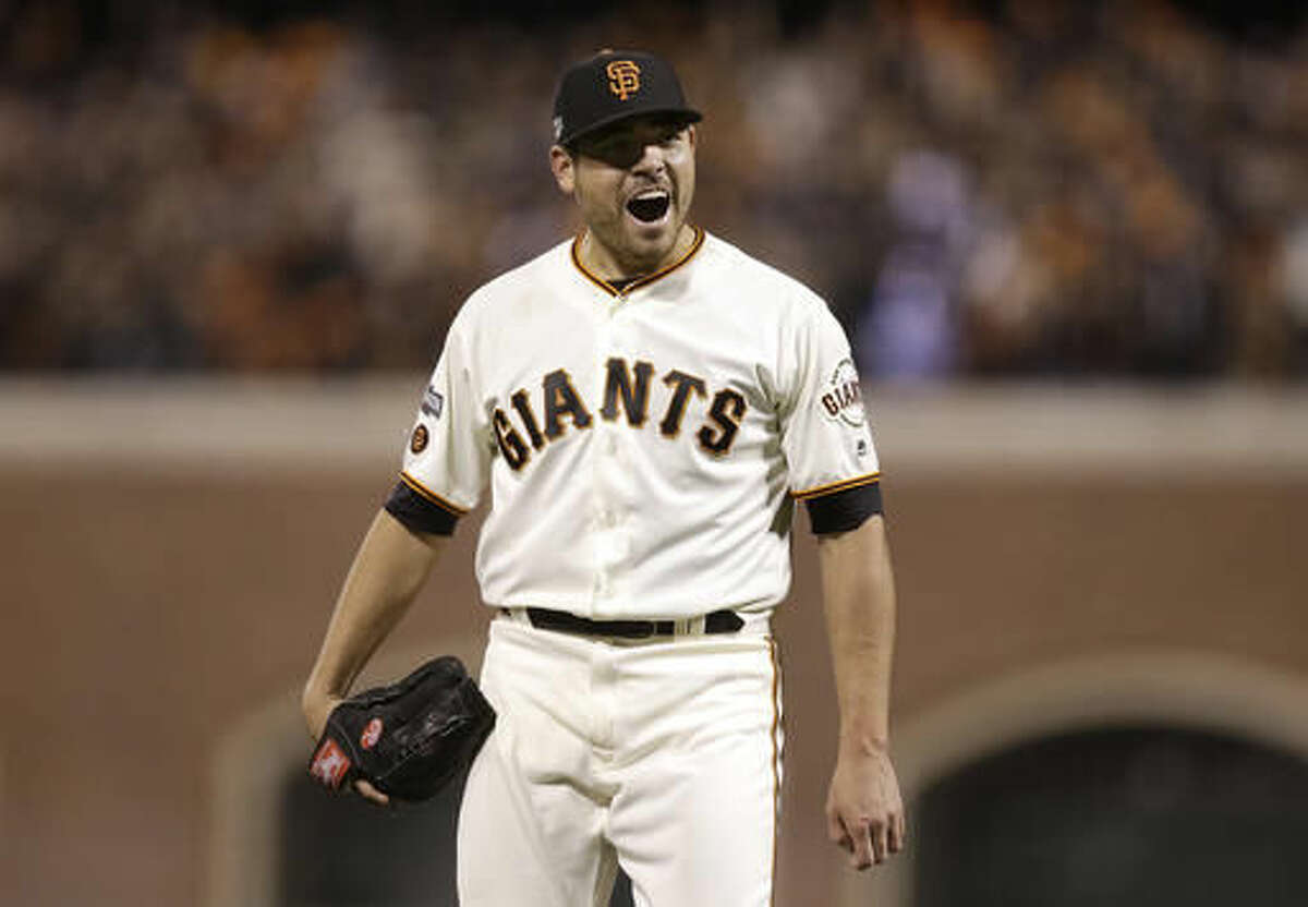 San Francisco Giants pitcher Matt Moore reacts after striking out Chicago Cubs' Dexter Fowler during the eighth inning of Game 4 of baseball's National League Division Series in San Francisco, Tuesday, Oct. 11, 2016. (AP Photo/Ben Margot)
