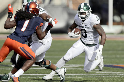 George leads Illinois to 31-27 win over Michigan State