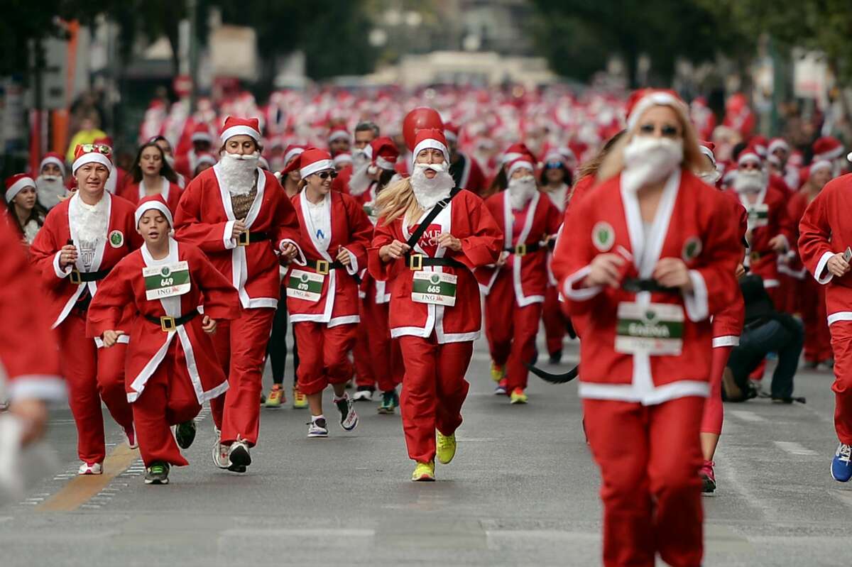Runners in the Santa Claus Run in Athens, Greece.
