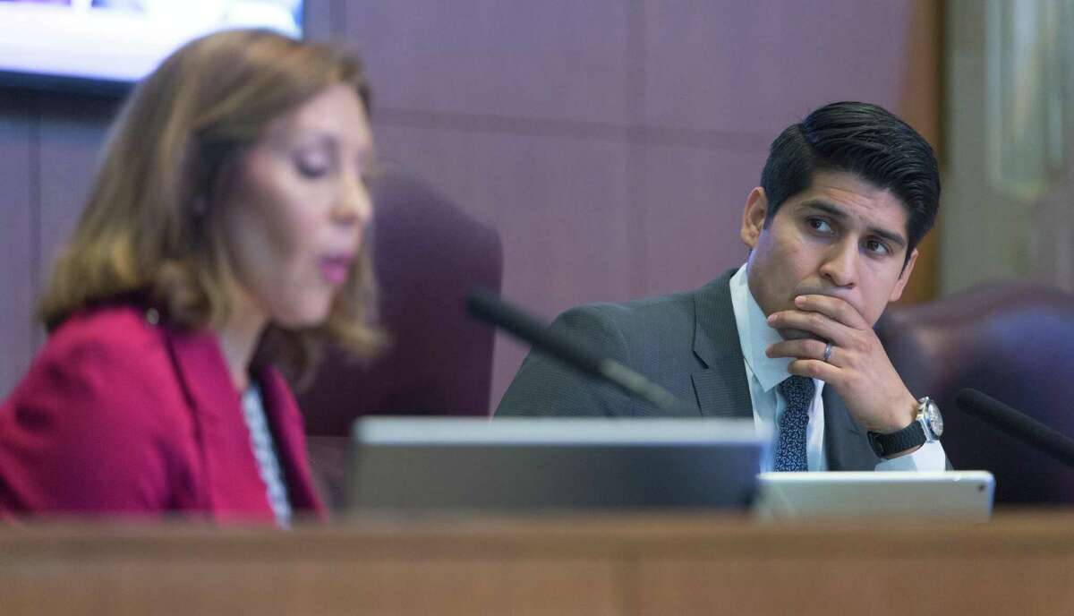 Council member Rey Saldana, right, listens as fellow council member Shirley Gonzales talks Thursday, Dec. 1, 2016 about the slate of planning commissioner candidates up for a council vote.