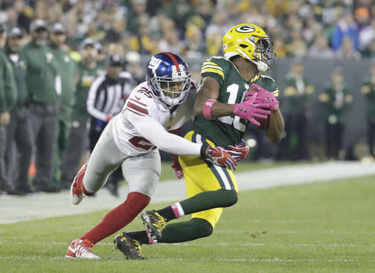 Green Bay Packers wide receiver Randall Cobb (18) reacts after making  yardage during the first quarter of an NFL game between the New York Giants  and the Green Bay Packers at the