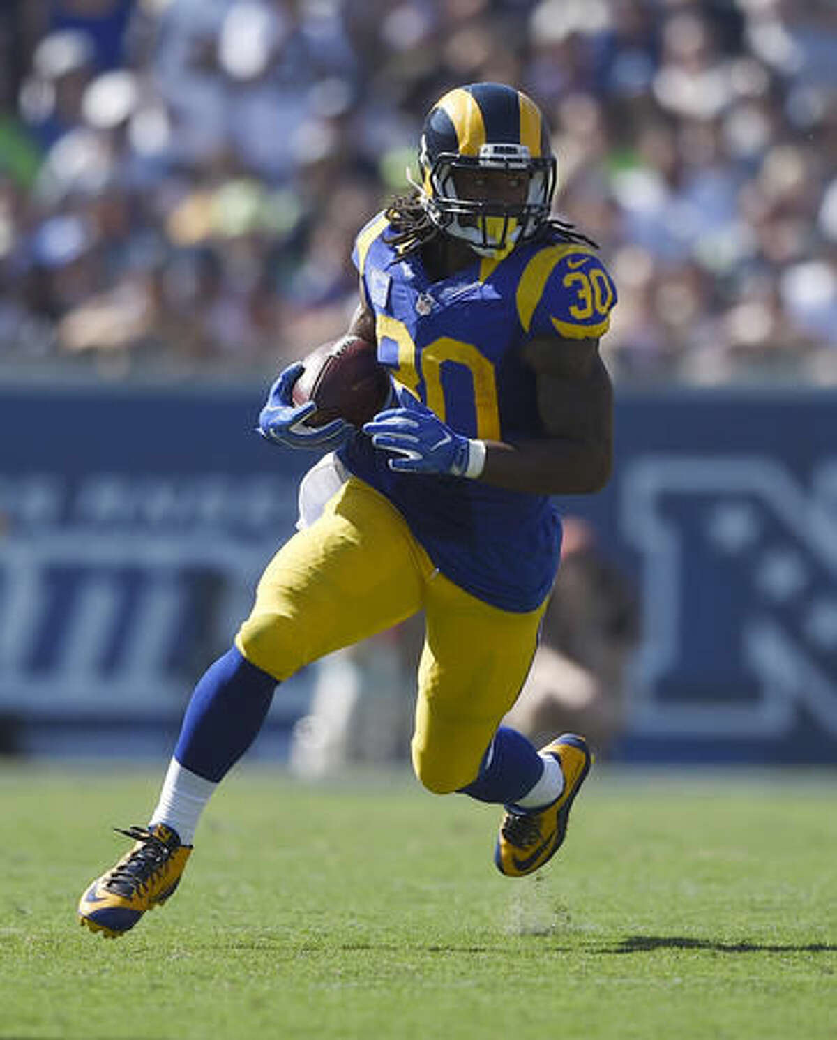 Todd Gurley of the Los Angeles Rams carries the ball for a 12 yard