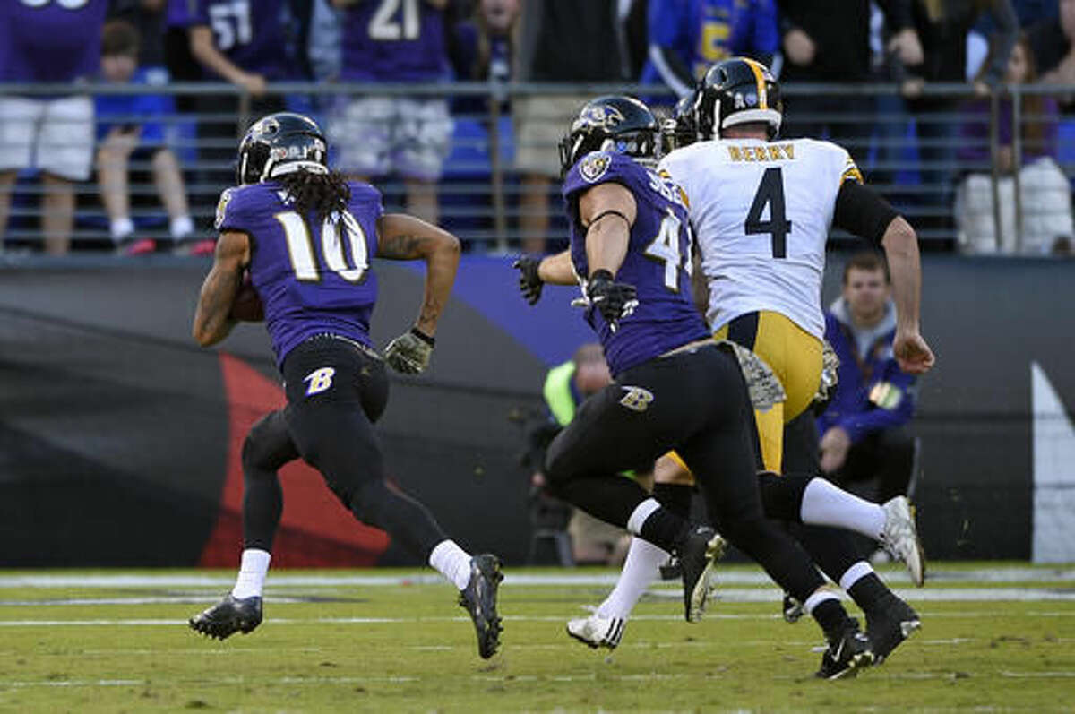 iBaltimore Ravens wide receiver Chris Moore (10) runs in a blocked punt for a touchdown past Pittsburgh Steelers punter Jordan Berry (4) and Ravens fullback Kyle Juszczyk, center, in the second half of an NFL football game, Sunday, Nov. 6, 2016, in Baltimore. (AP Photo/Nick Wass)