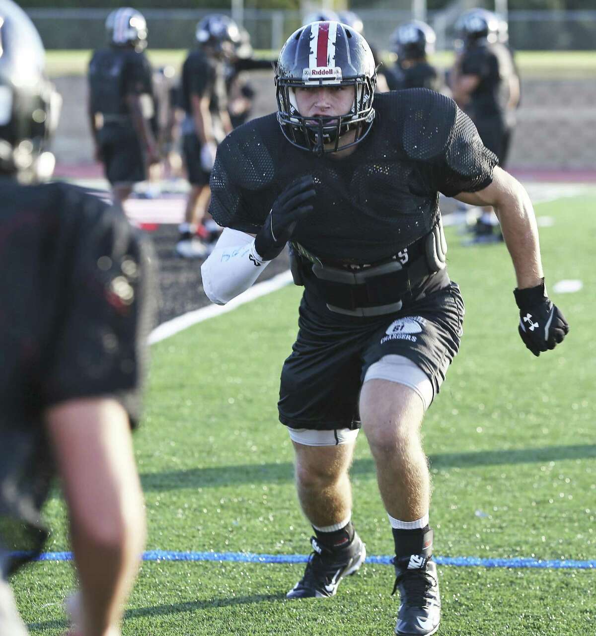 Churchill football player Cort Jaquess practice with the team on Dec. 1, 2016.