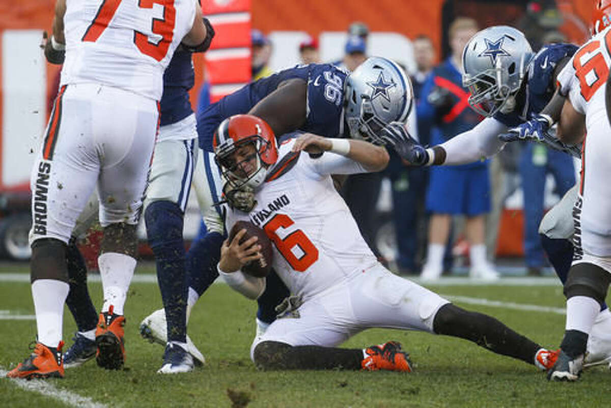 Cleveland Browns quarterback Cody Kessler (6) is sacked by Dallas Cowboys defensive tackle Maliek Collins (96) in the second half of an NFL football game, Sunday, Nov. 6, 2016, in Cleveland. (AP Photo/Ron Schwane)