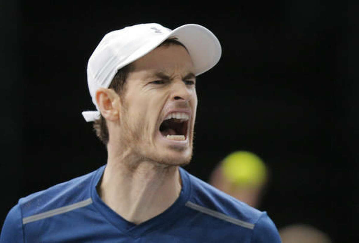 Britain's Andy Murray reacts after he breaks against John Isner of the United States during the final of the Paris Masters tennis tournament at the Bercy Arena in Paris, Sunday, Nov. 6, 2016. Murray won 6-3, 6-7, 6-4. (AP Photo/Michel Euler)