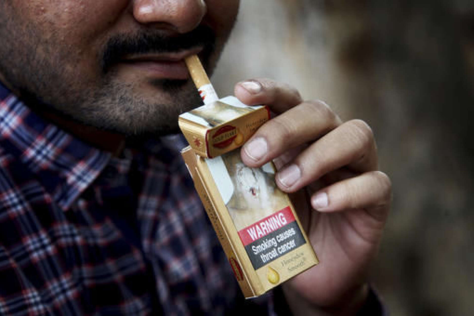 With mixed progress, nations review war vs. tobacco industry